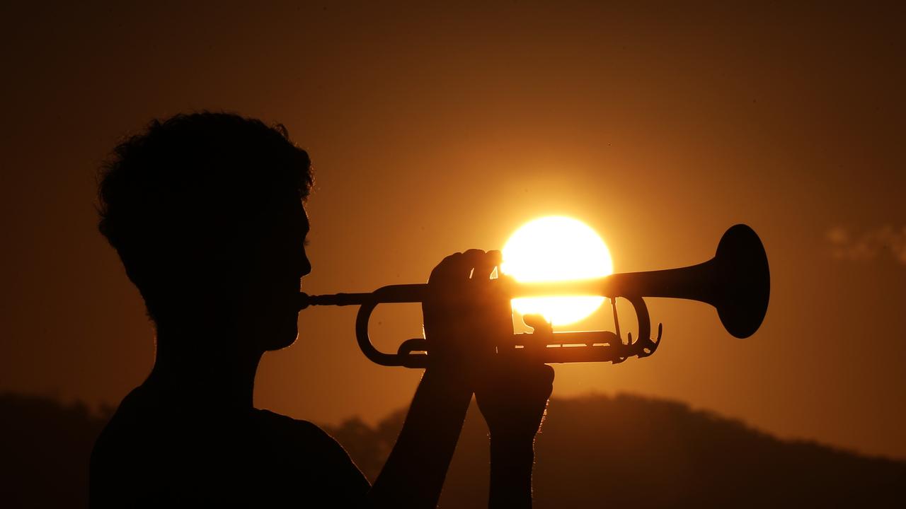 Lindisfarne year 10 student Monty Lush plays the Last Post as the sun sets over the Tweed Coast for ANZAC day.Photo: Scott Powick Newscorp