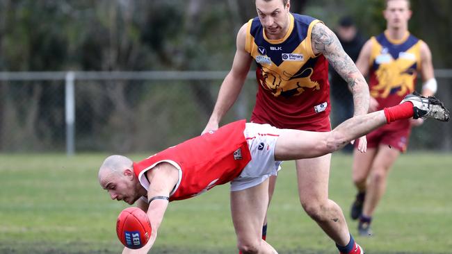 Sean Calcedo of the Bullants goes to ground at a centre bounce with Jonathan Adams of Therry Penola during the VAFA football match between Therry Penola v Preston Bullants played at Oak Park on Saturday 11th August, 2018.