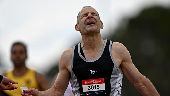 Grant Murfett wins his 200m heat as he pushes through the pain. Picture: Andy Brownbill