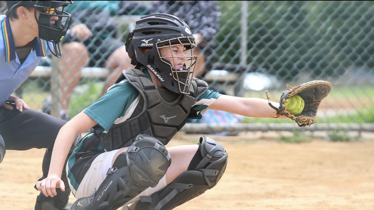 Evie King works behind the plate for Warriors. Picture: Julie Cooper Photography.
