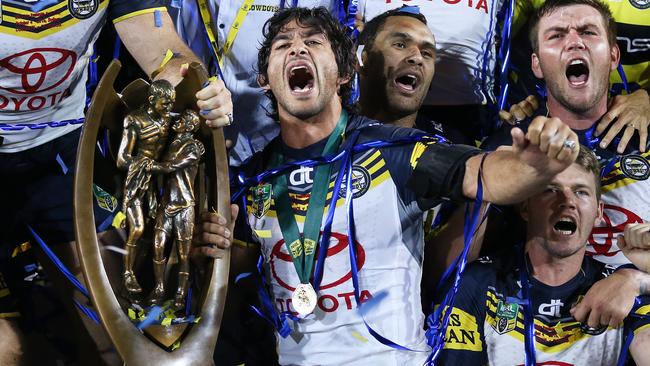 Johnathan Thurston captain of the North Queensland Cowboys celebrates with the premiership trophy after the Cowboys defeated the Brisbane Broncos in the 2015 NRL Grand Final at ANZ Stadium. Picture. Phil Hillyard