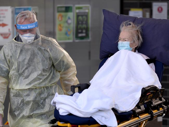 A resident is evacuated from Epping Gardens Aged Care Home. Picture: Andrew Henshaw