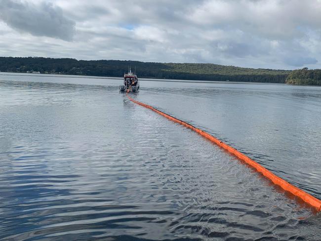 Flotation booms are being used to contain the leak. Picture: Fire and Rescue NSW