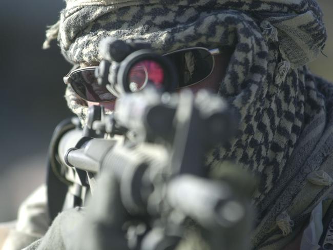 An Australian SAS trooper on patrol around Bagram Airbase in Afghanistan in 2002. Picture: John Feder