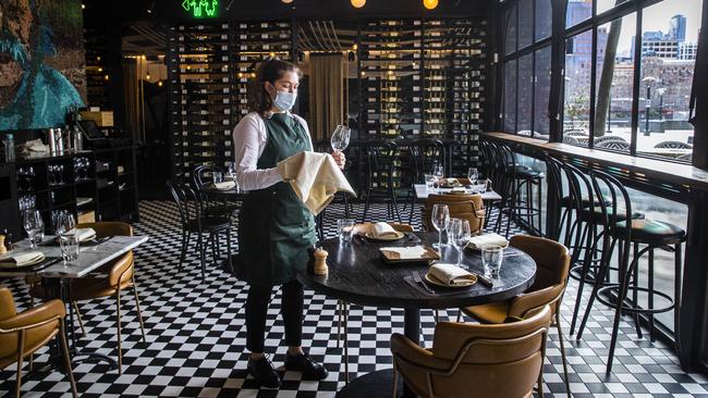 Augusta Rodriguez Tartac prepares for the lunch service at Melbourne’s deserted Asado restaurant, which had only one booking on Wednesday. Picture: Aaron Francis