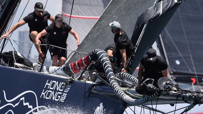 Crew aboard the boat "Scallywag" compete in the 2021 Big Boat Challenge, which brings together some of the biggest boats in the annual Sydney to Hobart fleet, on Sydney Harbour on December 7, 2021. (Photo by DAVID GRAY / AFP) / -- IMAGE RESTRICTED TO EDITORIAL USE - STRICTLY NO COMMERCIAL USE --