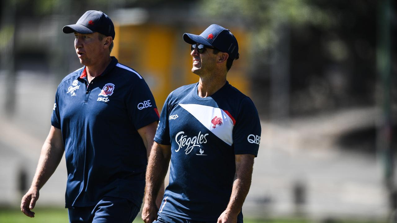 Things might be a little frosty next time (L-R) Trent Robinson and Andrew Johns meet at the beach. Picture: AAP Image/Brendan Esposito