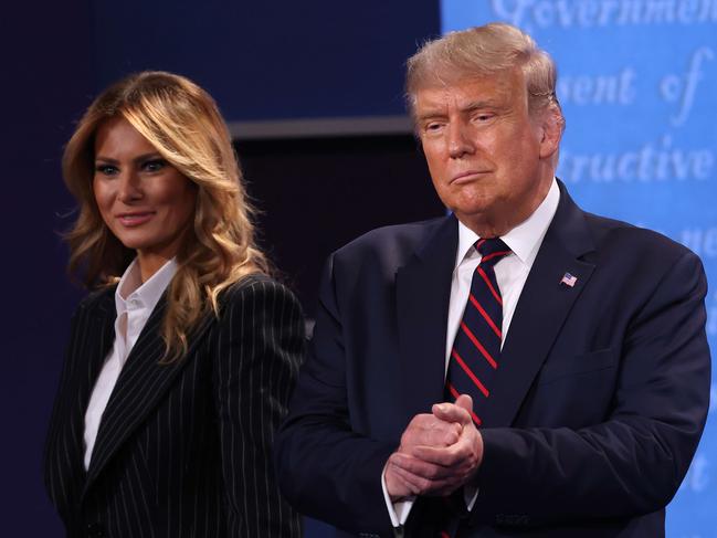 CLEVELAND, OHIO - SEPTEMBER 29: U.S. President Donald Trump and first lady Melania Trump on stage after the first presidential debate between Trump and Democratic presidential nominee Joe Biden at the Health Education Campus of Case Western Reserve University on September 29, 2020 in Cleveland, Ohio. This is the first of three planned debates between the two candidates in the lead up to the election on November 3.   Win McNamee/Getty Images/AFP == FOR NEWSPAPERS, INTERNET, TELCOS & TELEVISION USE ONLY ==