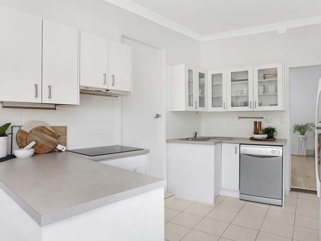 The apartment has a roomy, modern kitchen.