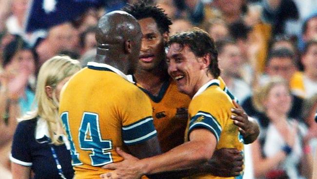 Lote Tuqiri, Wendell Sailor and Mat Rogers celebrate during the 2003 World Cup, which captivated the country.