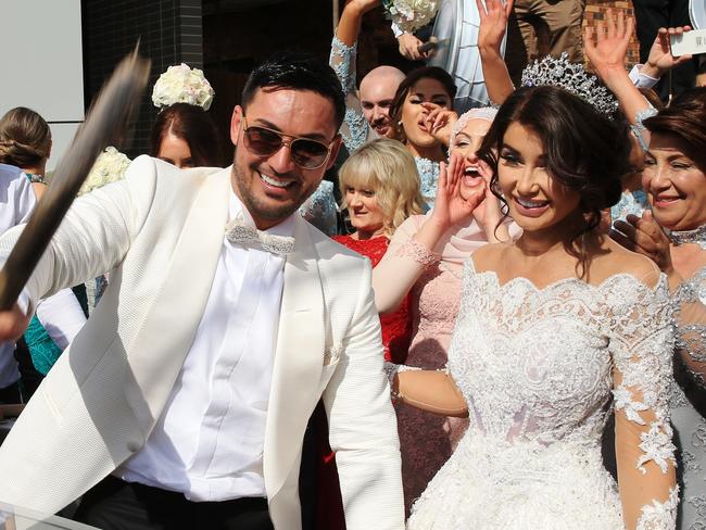 Auburn deputy mayor Salim Mehajer holds a lavish wedding in Lidcombe which involved helicopters, supercars, motorbikes, fighter jets a d dancing drummers and closed off Frances St. Salim and his bride Aysha hold a party outside their house. picture: Toby Zerna