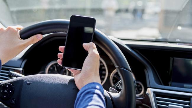 Penalties for using a mobile device while driving in Victoria have increased this year to a $577 fine and four demerit points. Picture: iStock
