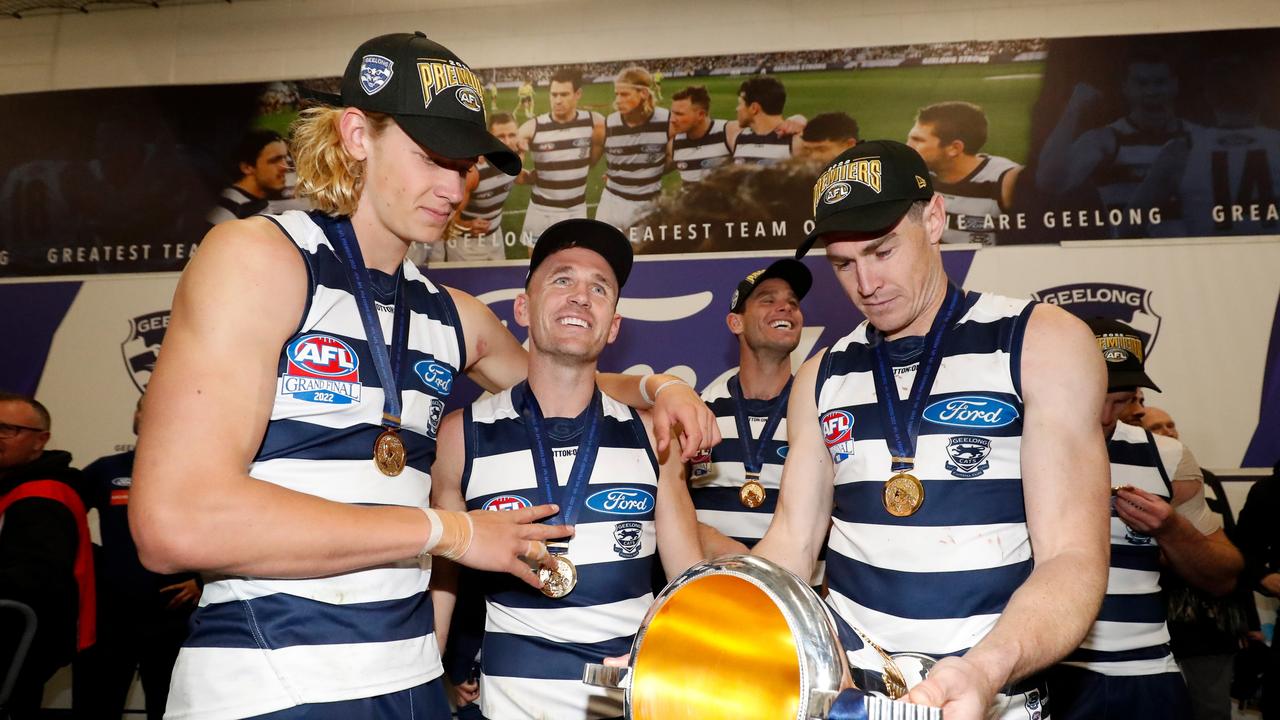 Sam De Koning, Joel Selwood and Jeremy Cameron in the rooms. Picture: Dylan Burns/AFL Photos via Getty Images