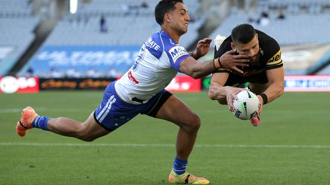 Josh Mansour of the Panthers scores a try during the round 20 NRL match between the Canterbury Bulldogs and the Penrith Panthers at ANZ Stadium.