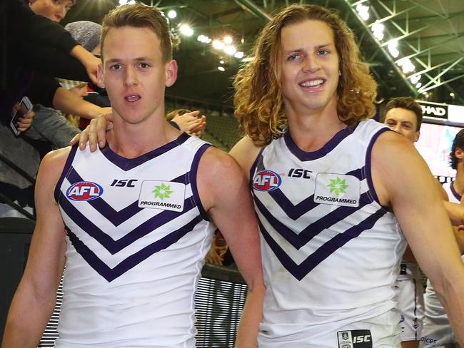 MELBOURNE, AUSTRALIA - JULY 09:  Ryan Nyhuis of the Dockers and Nat Fyfe of the Dockers celebrate as they leave the field after winning the round 16 AFL match between the North Melbourne Kangaroos and the Fremantle Dockers at Etihad Stadium on July 9, 2017 in Melbourne, Australia.  (Photo by Scott Barbour/Getty Images)