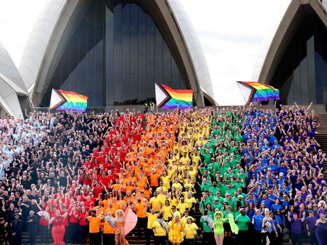 SYDNEY, AUSTRALIA - NewsWire Photos JUNE 24, 2022: Sydney siders create a human progress flag on the steps of the Sydney Opera House.Picture: NCA NewsWire / Damian Shaw