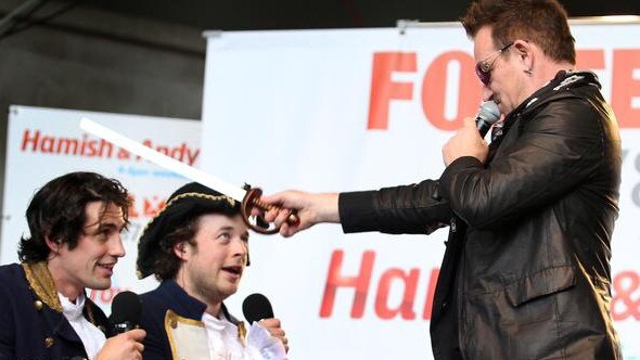 Bono does his royal duty with Andy Lee and Hamish Blake at the Myer Music Bowl