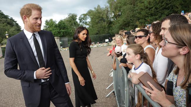 Prince Harry and Meghan Duchess of Sussex speak with well-wishers at Windsor Castle over the weekend.   Picture: Getty Images