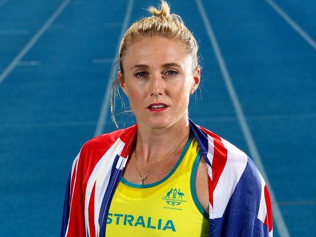 Australian athlete Sally Pearson poses with the Australian flag ahead of the 2018 Commonwealth Games on the Gold Coast. Picture: Adam Head