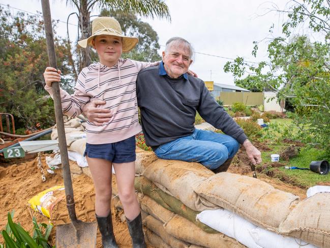 Ruby, 11 and Grandfather Hugh, 84Echuca prepares for the impending floods from both the Murray River and the Campaspe River. Authorities have started building a Levy and also lifting an existing levy, cutting some parts of the community off. Picture: Jason Edwards