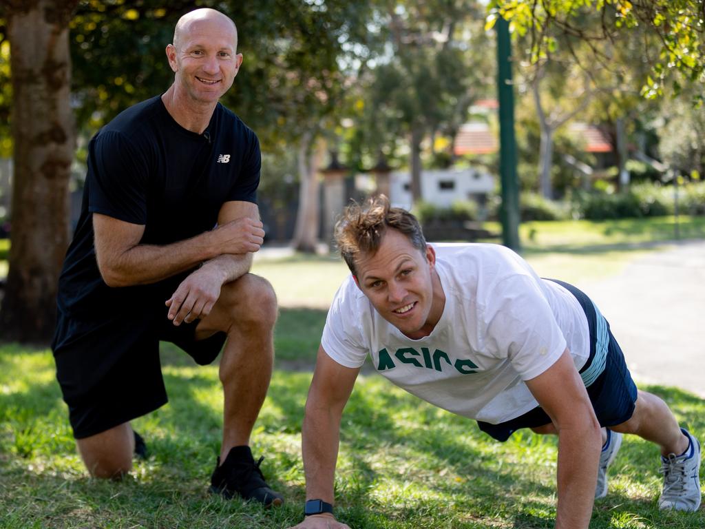Stephen Hoiles shows Adam MacDougall some of his fitness routine. Picture: Ray Bartholomeusz