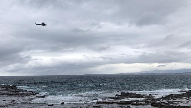 A police helicopter searches for Van Hai Tran at Port Kembla.