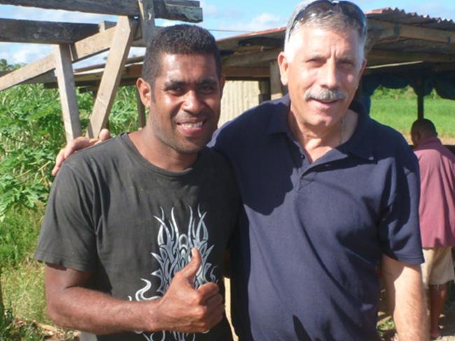 Agape Ministries leader Rocco Leo, right, at a Fijian village in a photo from the Whitehorse Ministries and Charity website.