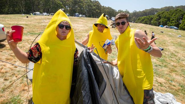 Max Mackay, 19, Jesse Barker, 19 and Scotty Morris, 18, pack up their site. Picture: Jason Edwards