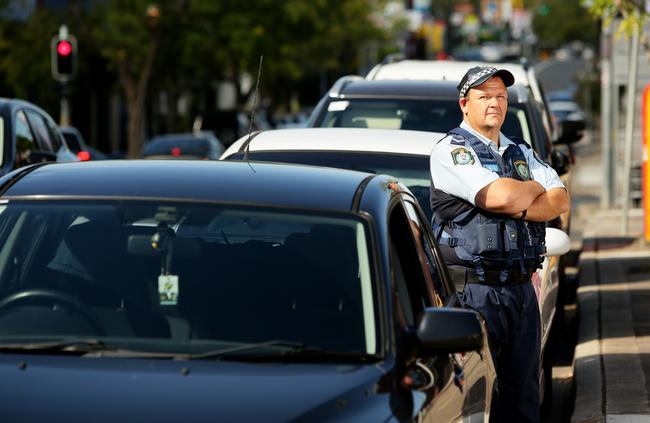 Constable Michael Kovacs warning drivers to lock their cars and not leave valuables in side them as well. Picture: Justin Sanson