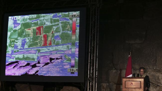 Anomaly hunting ... Live footage from a thermal camera of limestone blocks from the Khufu pyramid are displayed showing different colours representing varying temperatures during a press conference, in Giza. Source: AP