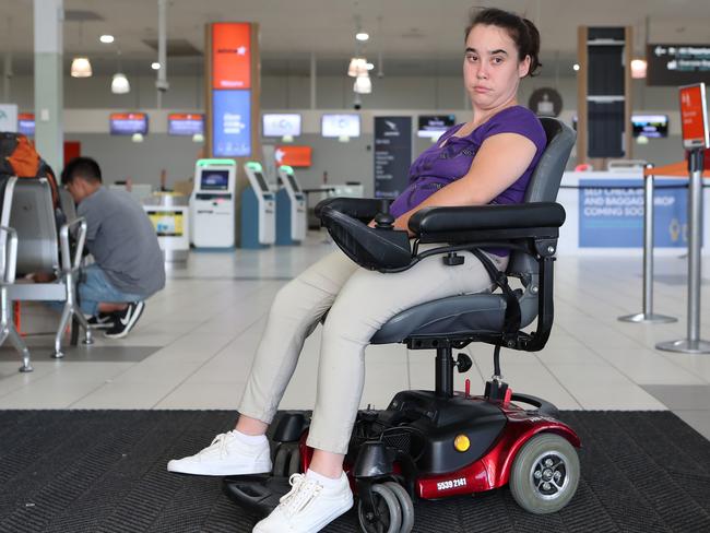 Amy Tobin flew an an international flight with Scoot who lost her wheelchair. Amy at Gold Coast Airport with a borrowed chair until hers hopefully is found and returned. Picture by Scott Fletcher