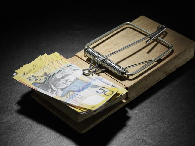 Australian dollars in a mousetrap. money, generic $50 notes