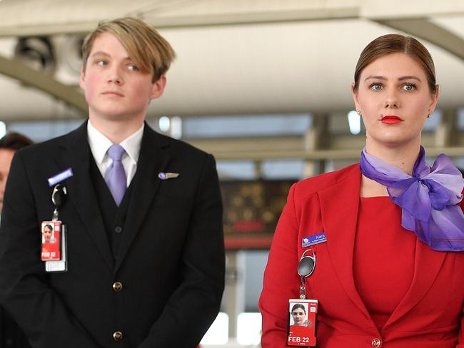 Virgin Australia employees watch on as Opposition Leader Anthony Albanese addresses media at Sydney Airport, in Sydney, Tuesday, April 21, 2020. Virgin confirmed it had gone into administration on Tuesday, threatening up to 10,000 airline jobs after a board meeting of its international shareholders voted on Monday against providing additional financial support. (AAP Image/Dan Himbrechts) NO ARCHIVING