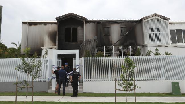 Police at the scene of a declared a crime scene in a unit complex on Beenleigh Road, after a fire destroyed a unit. Photo Steve Pohlner