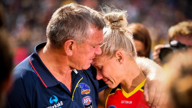 Former footballer Greg Phillips embraces his daughter Erin after the 2019 Grand Final match. Picture: Daniel Kalisz/Getty Images