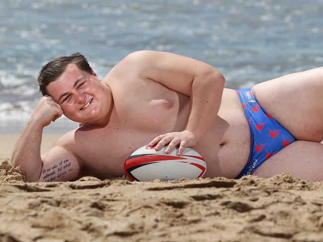 Nic White reclines in his swimming jocks on Manly Beach. Picture: Martin Lange.