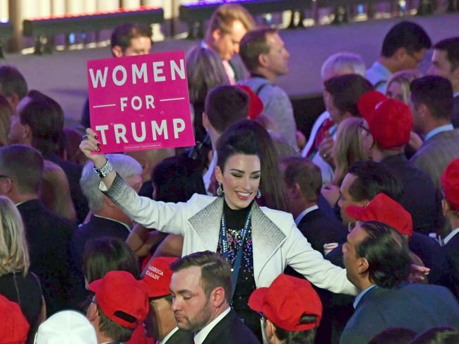 A supporter of Republican presidential nominee Donald Trump celebrates during election night at the New York Hilton Midtown in New York on November 9, 2016. / AFP PHOTO / JIM WATSON