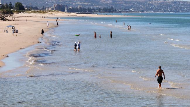 Beach goers at Henley Beach enjoying the warm weather. Picture: NCA NewsWire / Kelly Barnes