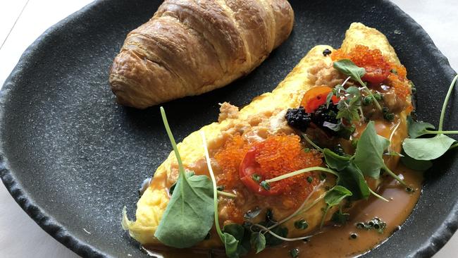 The croissant St Denis — ghetto style crab omelette — at Devon Cafe at Garden City, Mt Gravatt.