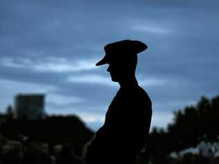 A solider stands guard during an Anzac Day dawn service. Picture: Scott Powick