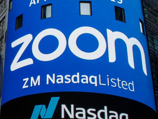 (FILES) In this file photo Zoom founder Eric Yuan poses in front of the Nasdaq building as the screen shows the logo of the video-conferencing software company Zoom after the opening bell ceremony on April 18, 2019 in New York City. - Zoom shares soared on August 31 after the video-meeting service reported that quarterly revenue rocketed as its ranks of users more than quadrupled. (Photo by KENA BETANCUR / GETTY IMAGES NORTH AMERICA / AFP)