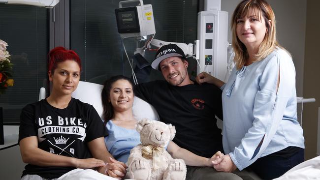 Christina with her twin sister Irene (left), fiance James Wild and mum Maria at the Royal Adelaide Hospital Spinal Unit. Picture: Matt Turner