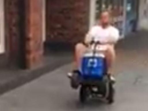 Screen grab from a video posted on the facebook page of Camden Hotel showing James Wallace riding a motorised esky. Picture: Facebook