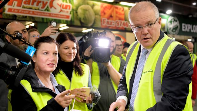 Scott Morrison and his wife Jenny shop for green chillies at the Sydney Markets. Picture: Getty Images.