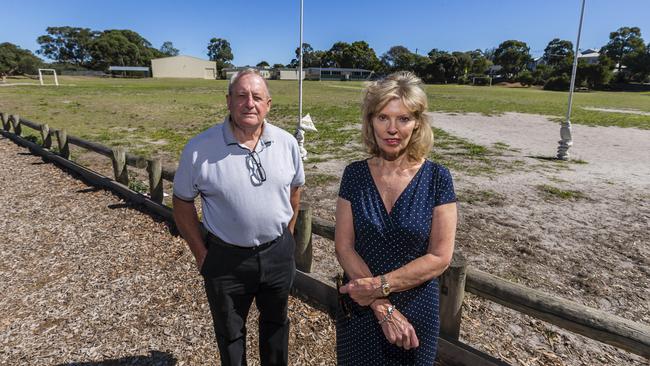 John Oliver and Kate Smith are unhappy with a Black Rock Primary school proposal to replace their oval with synthetic grass. Picture: Valeriu Campan