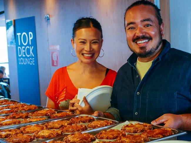 Scenes from new SBS TV series Adam and Poh’s Great Australian Bites featuring foodies Poh Ling Yeow and Adam Liaw. One episode was filmed in Tasmania. Poh and Adam serving Tassie beef pies on the Spirit of Tasmania. For TasWeekend. Picture: SBS Publicity.