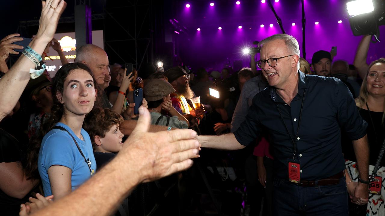 Earlier in the night, Mr Albanese and partner Jodie Haydon received a far warmer reception while moving through the crowd. Picture: Toby Zerna