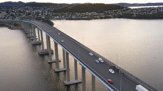 John Elliott crosses the Tasman Bridge with his five camels on Sunday morning. Picture: Nick Jaffe.