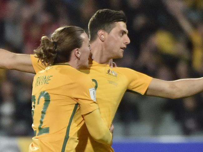 Tomi Juric and Jackson Irvine from Australia celebrate a goal during the 2018 FIFA World Cup Asian Qualifier match between Australia and Saudi Arabia at the Adelaide Oval in Adelaide, Thursday, June 8, 2017. (AAP Image/David Mariuz) NO ARCHIVING, EDITORIAL USE ONLY