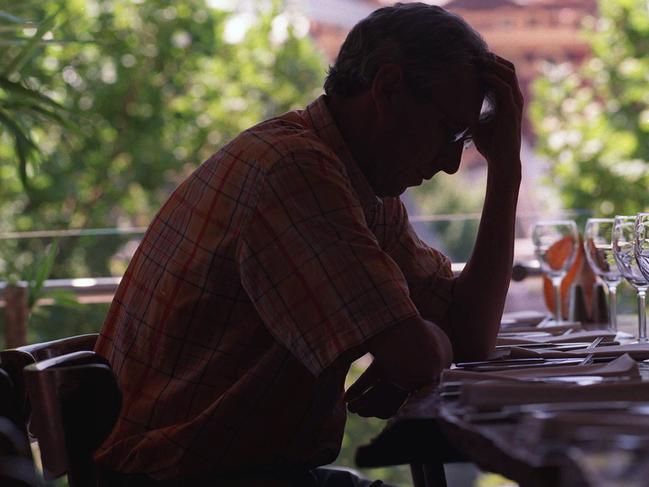 Man with hangover. Alcoholism. Drinking. Generic image.